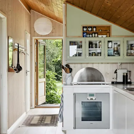 House By Forest And Roskilde Fjord's Waves